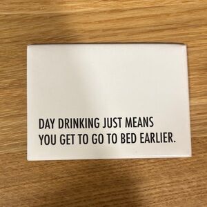 “Day drinking just means you get to go to bed earlier” magnet. 3.5” x 2.5”